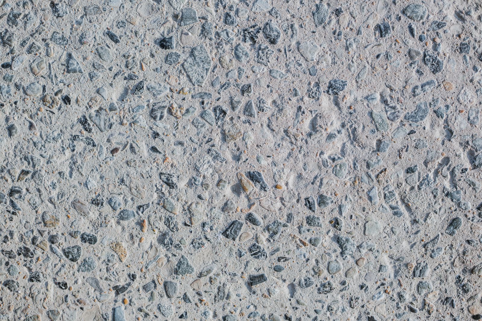 Close up of aggregate texture in a concrete floor surface that adds slip resistance