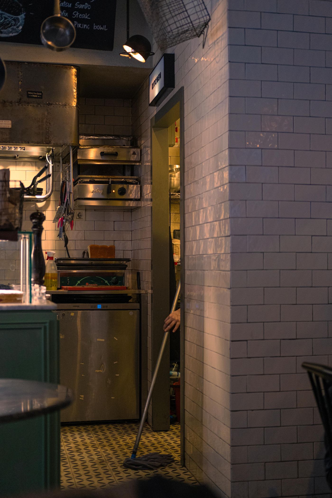 Restaurant kitchen interior with a hard wearing floor surface under cooking equipment