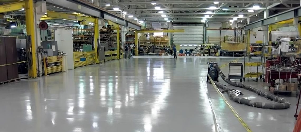 Factory floor coated with industrial-grade coatings by Memphis Coatings Company, enhancing durability, safety, and performance.